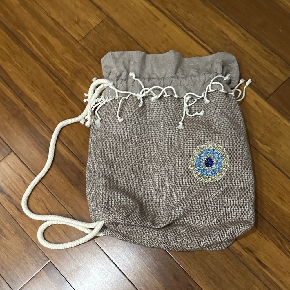Tan Knit Drawstring Bag with Eye Design